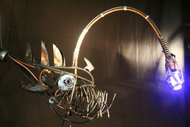 Metal steampunk angler fish. copper, steel, nails, rebar, power, lighted, gears