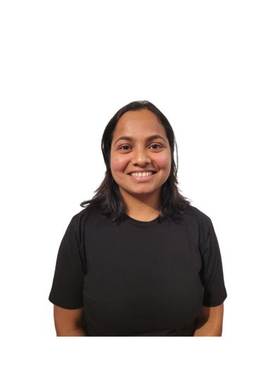 Smiling woman with dark hair wearing a black t-shirt against white background.