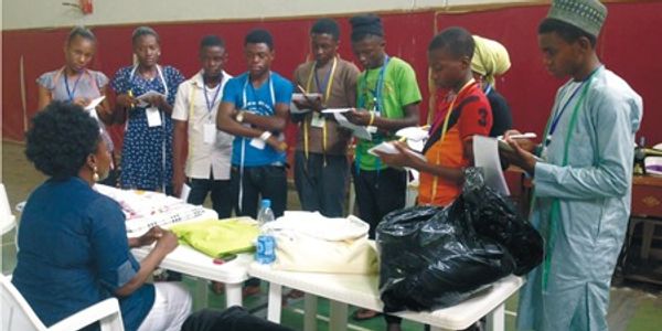 A woman Sit on the chair with Media and reporter writing notes