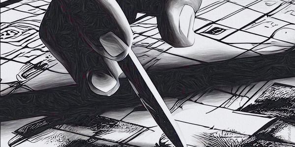 Hand filling in a crossword puzzle with a pencil.