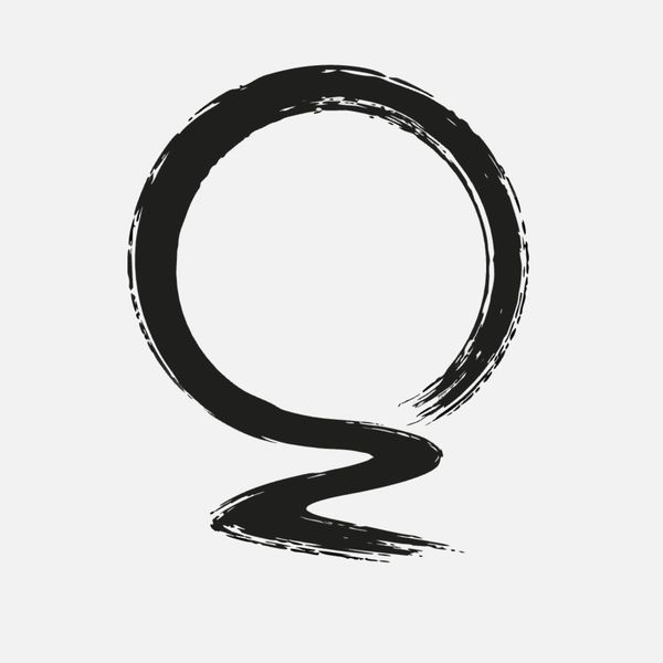 A black enso circle painted in a single expressive brushstroke, representing awareness, incompletene