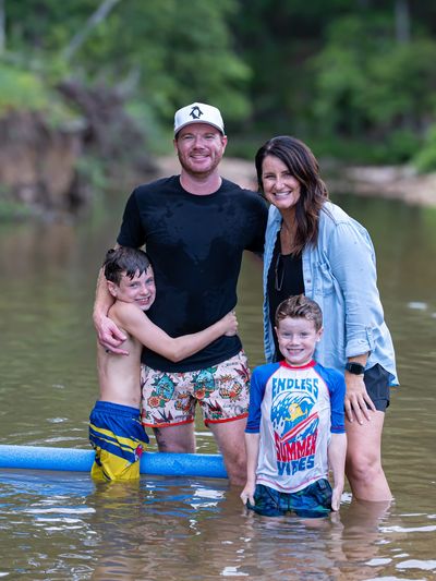Family enjoying time together in a river.