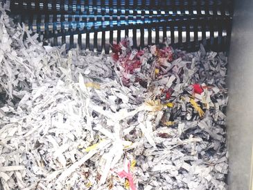 Close-up of shredded paper inside a shredder. the shred shop camberly, surrey. For domestic 