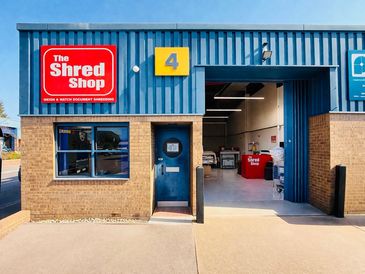 Exterior of a document shredding business named The Shred Shop.