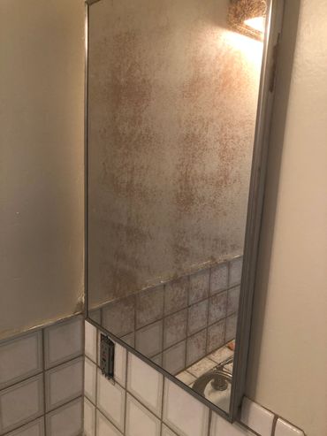 Mirrors in upstairs bathroom needs replacing.