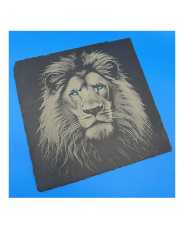 Lion with blue eyes engraved on slate