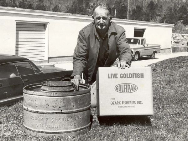 Bob Cramer, Ozark Fisheries Sales Manager in the 1950s showing the upgrade from metal railroad cans 