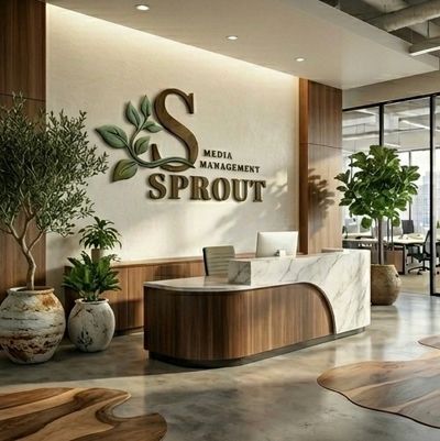 Modern office reception with wooden accents and green plants.