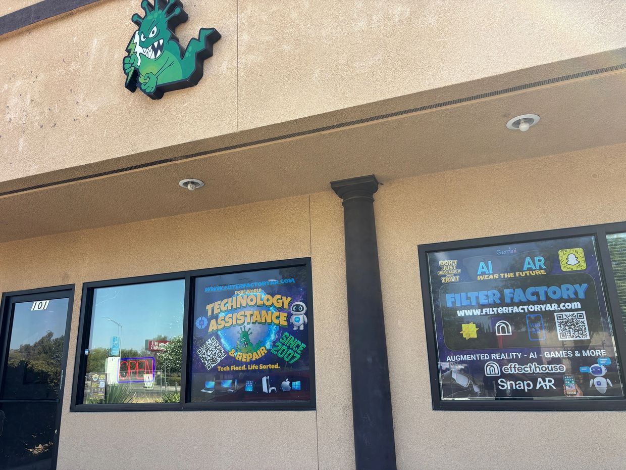 Storefront with technology assistance and AR filter factory signs.