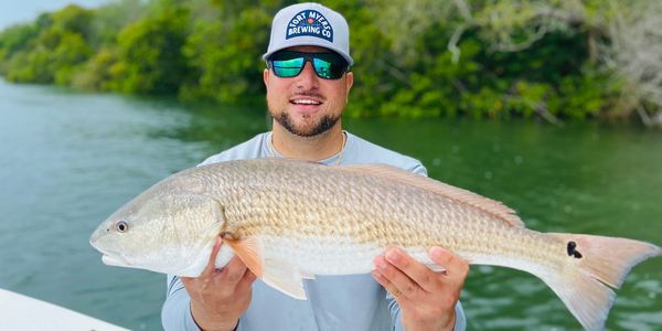 Capt Nick with A big redfish Caught in Cape Coral waters 