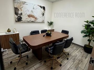 Modern conference room with six chairs.