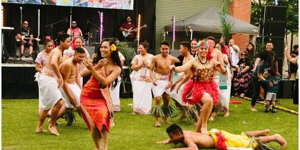 Samoan girls and boys dancing traditionally