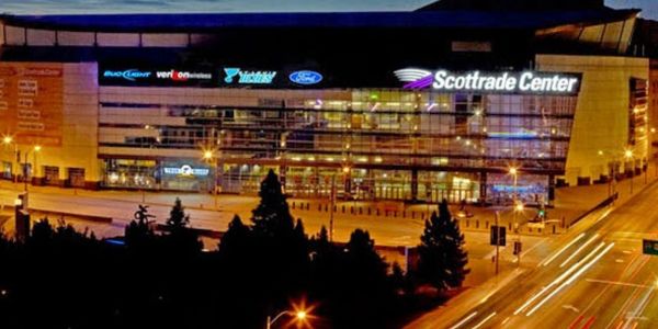 Night view of Scottrade Center with illuminated signage and lights.