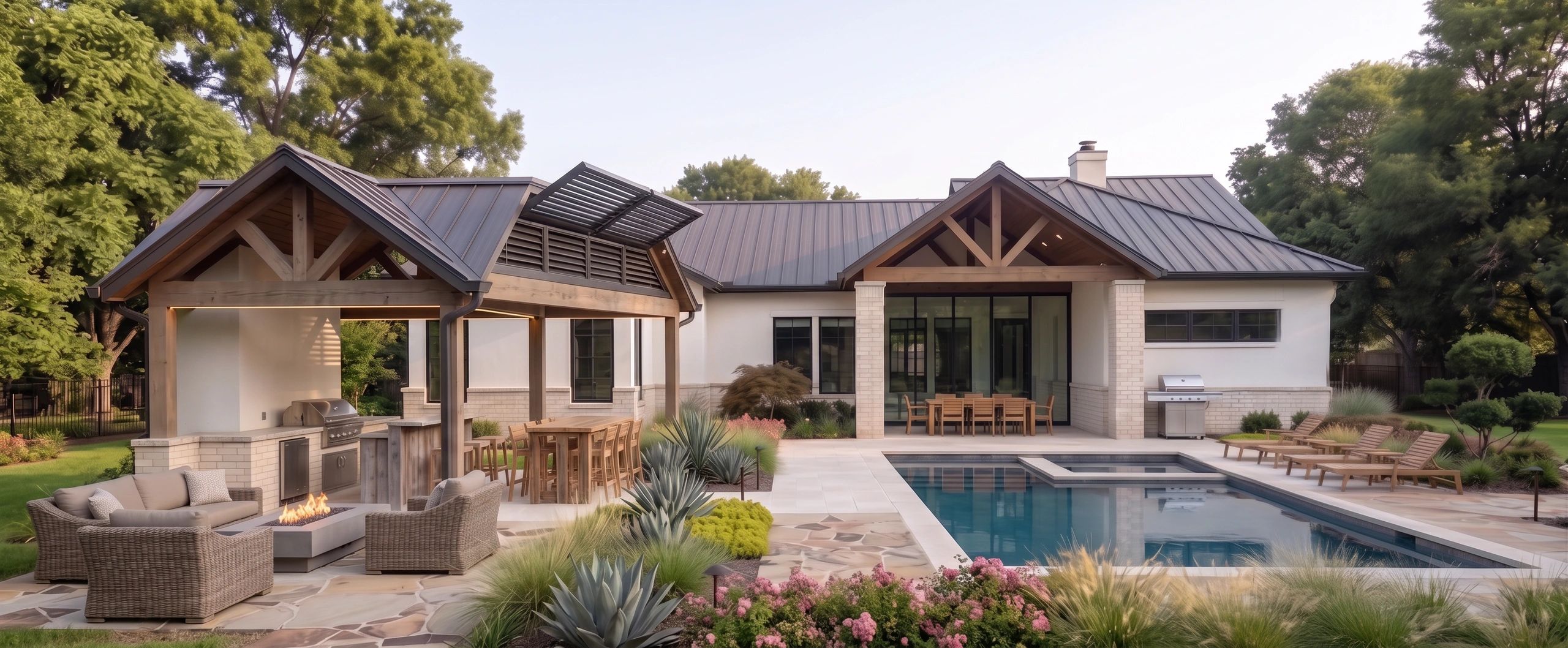 Modern outdoor living space with pool, comfy seating, and wooden pergola.