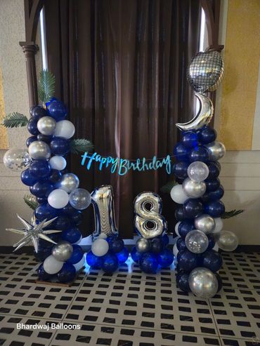 Elegant navy blue and silver balloon decoration for an 18th birthday celebration at home. 