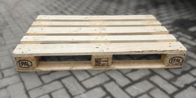 Wooden EPAL pallet on stone pavement.