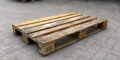 Wooden pallet on concrete ground.