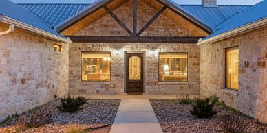Chula Vista lodge front entrance at night in Concan, TX.
