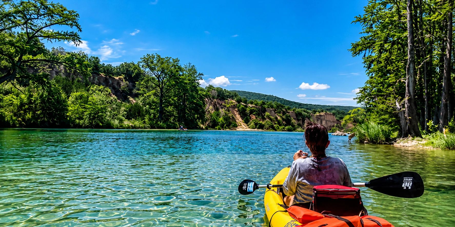 photo of someone on kayak on the Frio  River in Concan, TX.