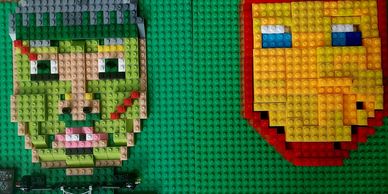 Faces created with colourful building bricks as part of a creative art workshop.