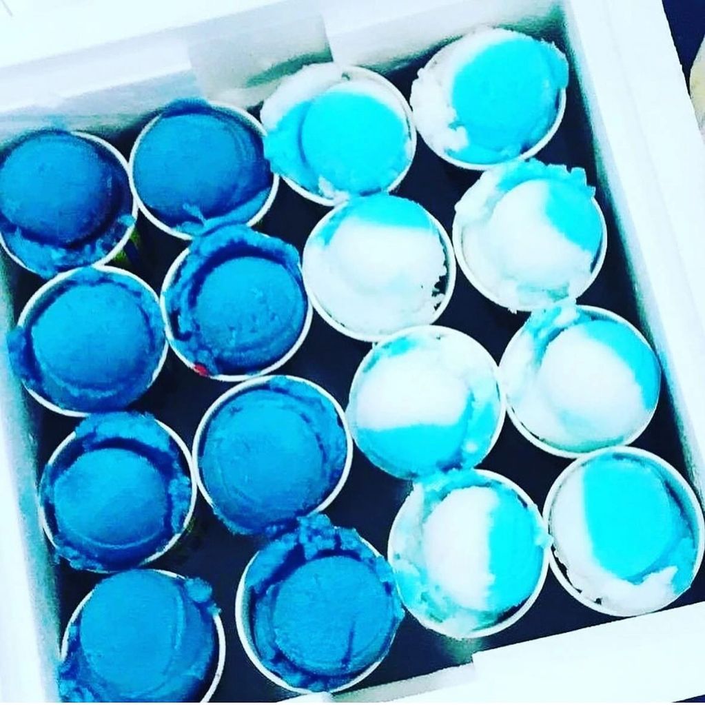 Top view of blue and white ice cream cups arranged in a box.