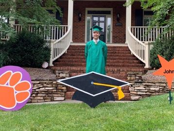 Graduation yard signs. Graduation cap, name sign and college sign.