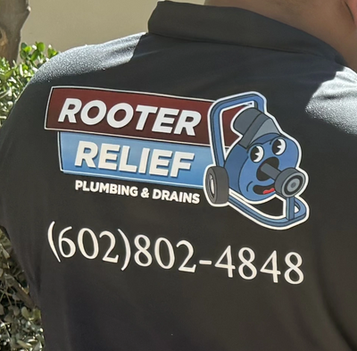 Back of a shirt advertising Rooter Relief plumbing services with a phone number.