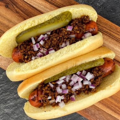 Grilled Hot Dog with Chili Sauce, Red Onion, and Pickle