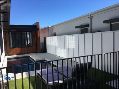 1.8m high FC Sheet with joint covers and capping ,Painted and Black custom Pool fencing.