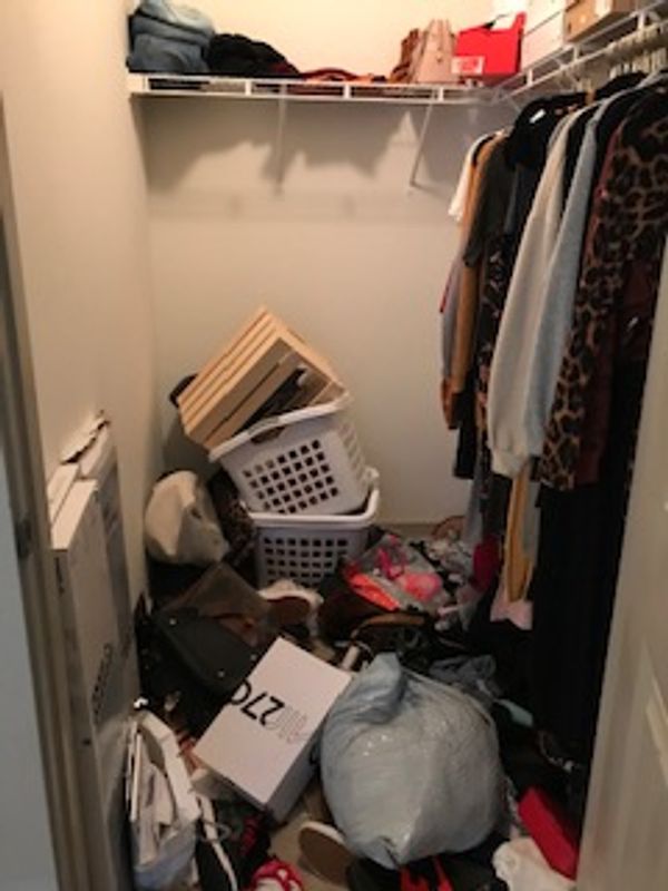 Picture of unorganized closet.