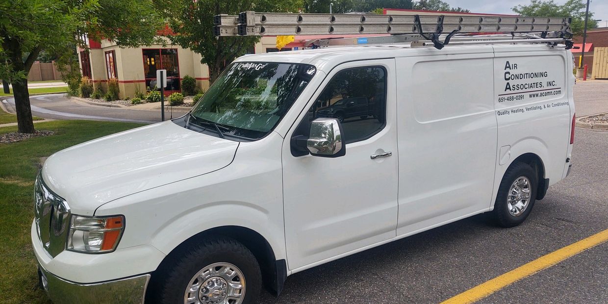 White service van with ladders on top for Air Conditioning Associates, Inc.