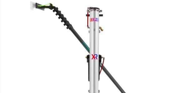 A modern agricultural sprayer tool with an extended nozzle and brush attachment.