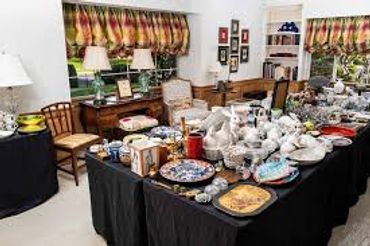 A table filled with various dishes and decorative items in a room.