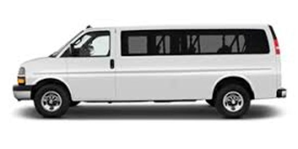 White passenger van from side view.