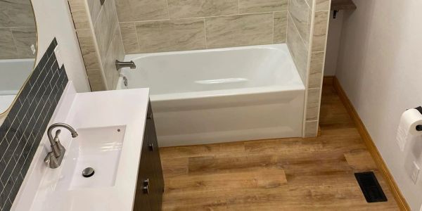 Modern bathroom with bathtub and sink.