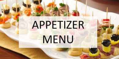 Appetizer menu sign with assorted bite-sized appetizers.