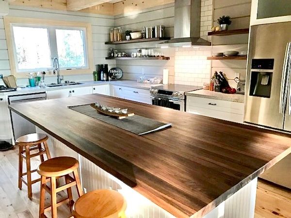 Modern cottage kitchen design with floating shelves