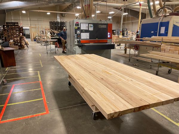 Butcher block countertops being flattened in production shop