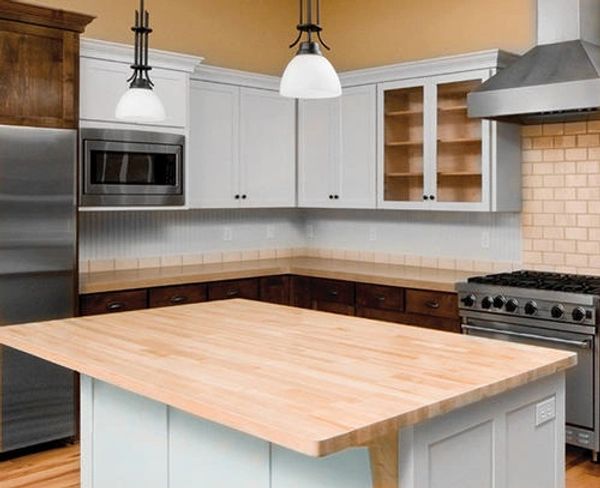 Modern white kitchen with white pine island countertop