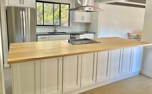 Modern kitchen with island and butcher block countertop