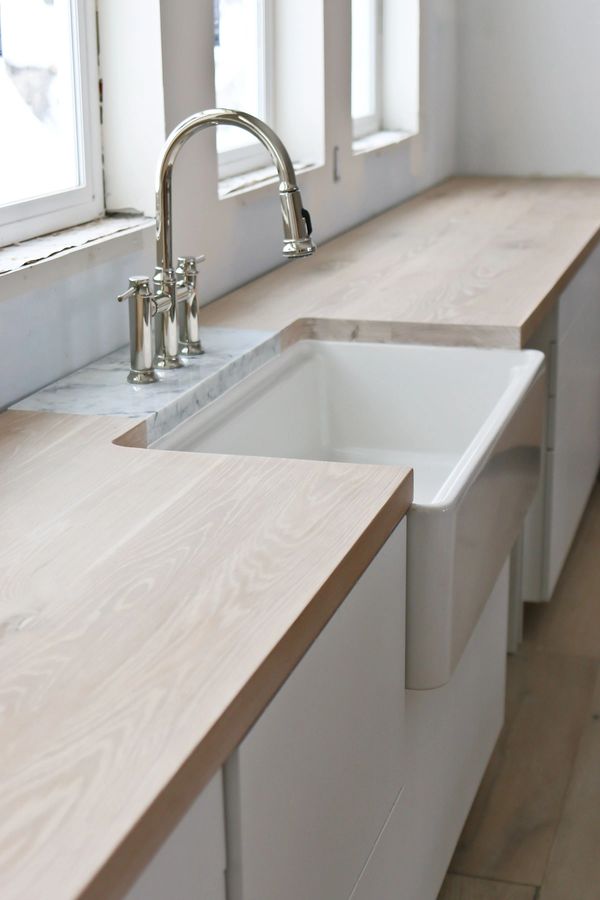 Modern kitchen with farm sink and white ash countertop