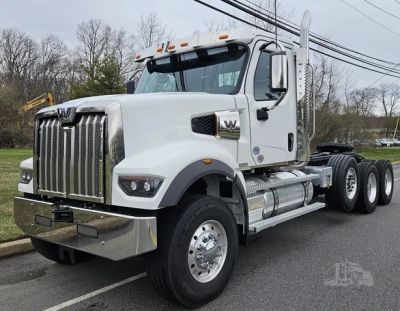White heavy-duty semi truck parked on street.
