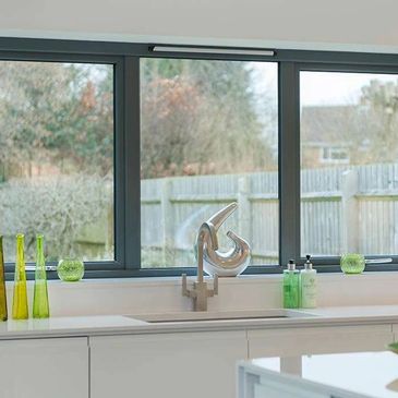 Inside kitchen windows that have a black frame and have been cleaned 