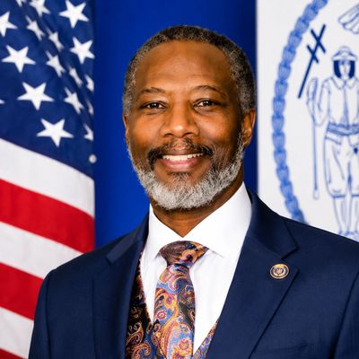 Professional man in suit with flags background.