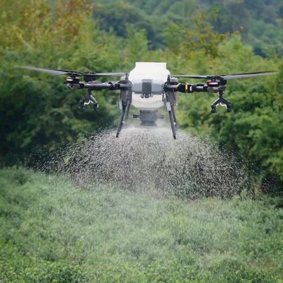 TopXGun FP700 agricultural drone seeding a field - North Wales Agri Drones