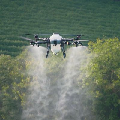 TopXGun FP700 agricultural drone spraying a field - North Wales Agri Drones
