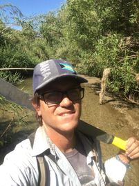 Owner and principal biologist Dr. Jon Feenstra after hours of machete work.