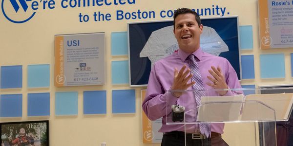 Executive coach giving keynote speech at diversity equity inclusion event 