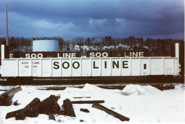 Soo Line freight train car in snowy area.