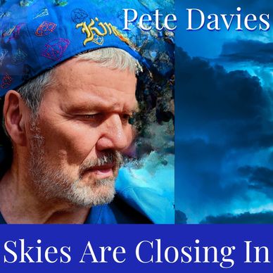 Pete Davies looking thoughtful with a brooding storm developing behind him. The words, “Skies Are Cl